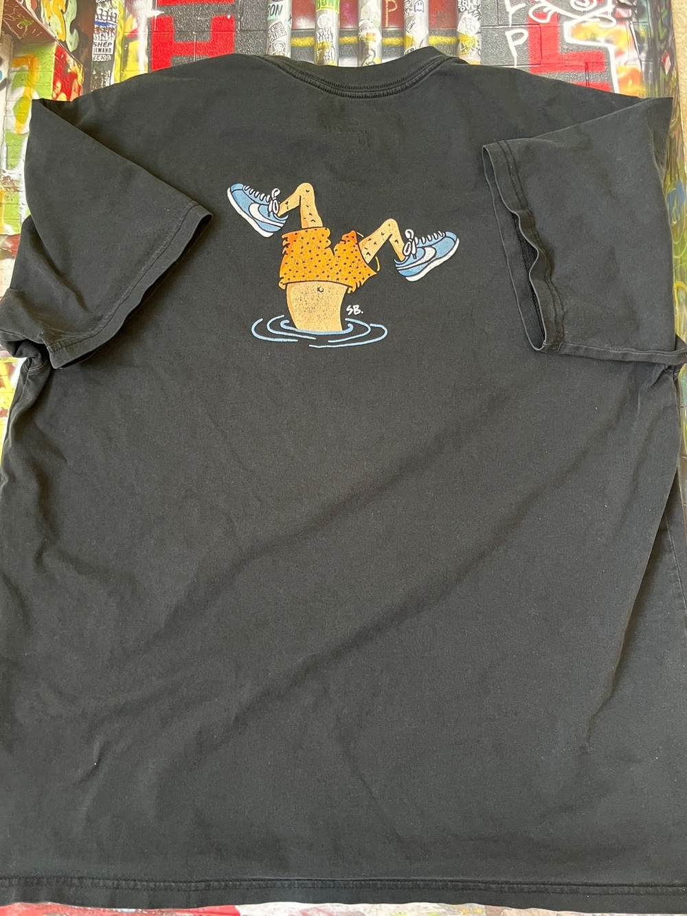 Nike Black Tee with swimmer graphic.